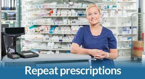 Person at desk of a pharmacy counter